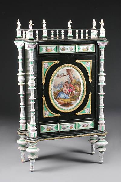 Appraisal: A German porcelain mounted ebonized cabinet fourth quarter th century