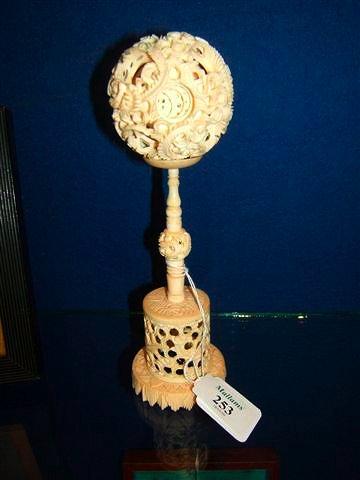 Appraisal: An Oriental carved ivory puzzle ball and stand the ball