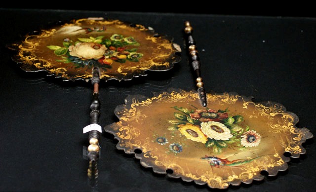 Appraisal: A matching pair of painted fans featuring birds of paradise