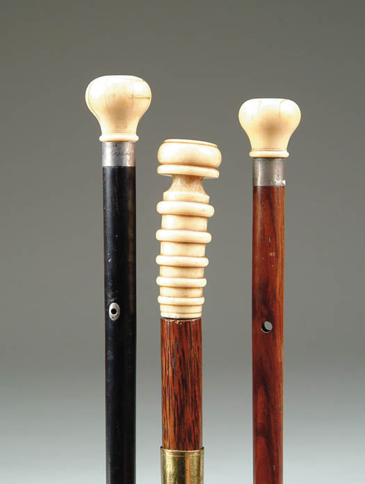 Appraisal: THREE IVORY TOPPED CANES tapered cane with ivory knob top