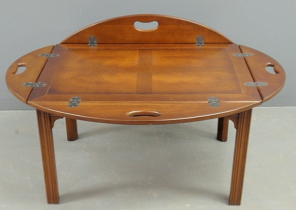 Appraisal: - Chippendale style mahogany butler s tray table by Baker