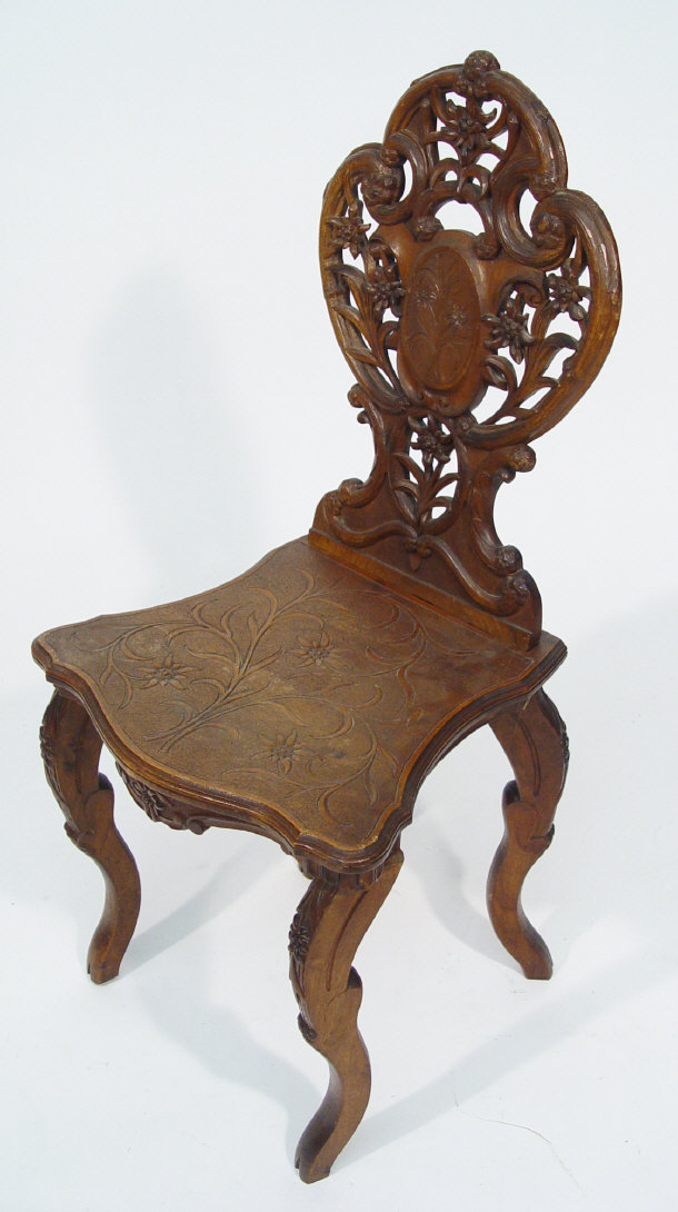 Appraisal: Victorian walnut hall chair with floral carved back and seat