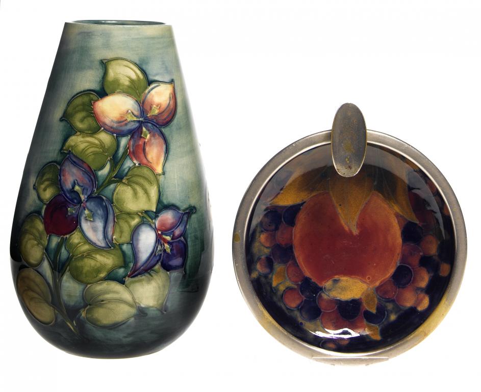 Appraisal: A MOORCROFT BOUGAINVILLAEA VASE DESIGNED BY WALTER MOORCROFT AND A