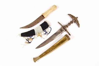 Appraisal: An African dagger with a curved double edged blade and