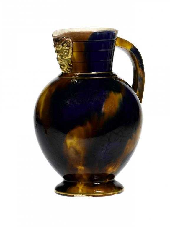 Appraisal: A WEDGWOOD MAJOLICA DORIC JUG with gilt satyr mask lip