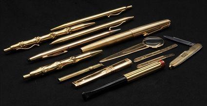 Appraisal: Two Tiffany Co k Gold Pens Together with a Cartier