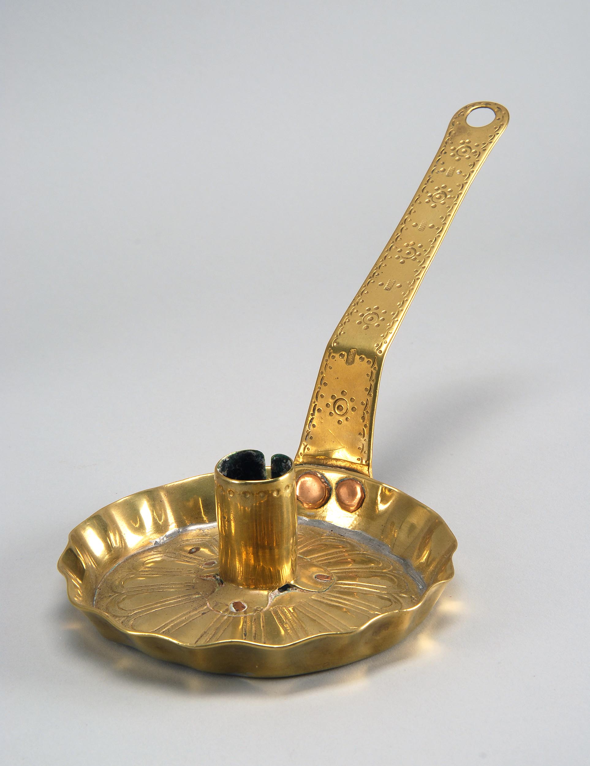 Appraisal: TH CENTURY BRASS CHAMBER STICK with engraved handle and flower-form