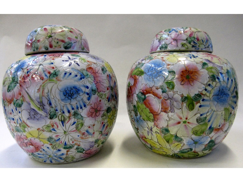 Appraisal: Pair of oriental ginger jars heavily decorated with flowers