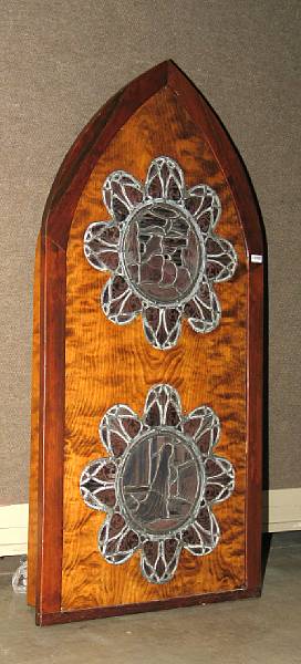 Appraisal: A stained glass panel in a Gothic style hardwood frame