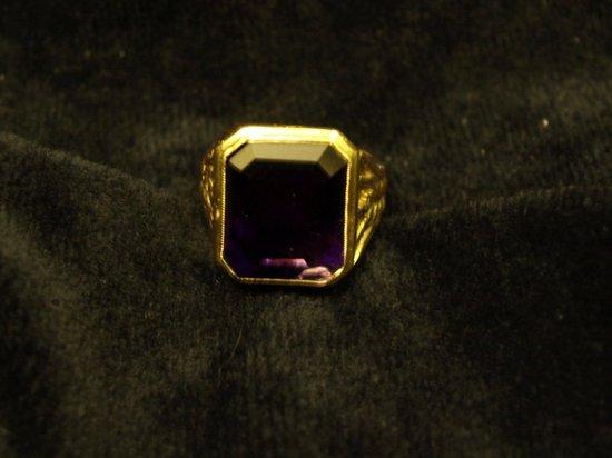 Appraisal: A Pontifical ring set a square amethyst in a setting