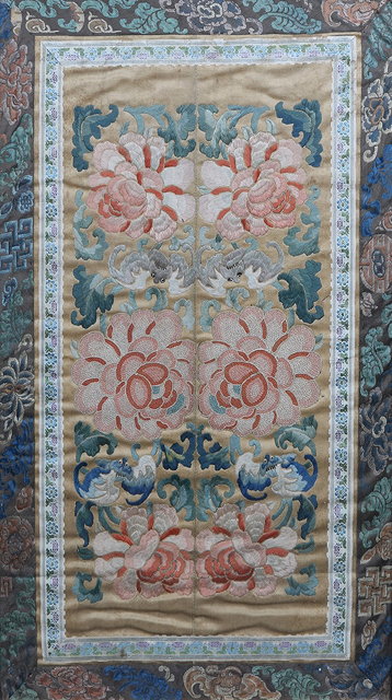 Appraisal: TWO CHINESE SILK SLEEVE PANELS with polychrome foliate decoration within