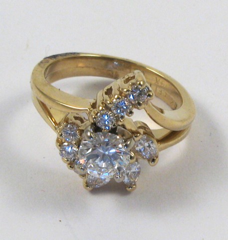 Appraisal: DIAMOND AND FOURTEEN KARAT GOLD WEDDING SET The engagement ring