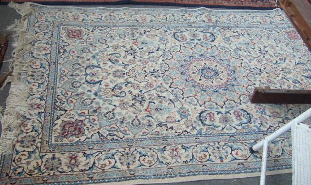 Appraisal: A five part silk Nain rug the ivory field with