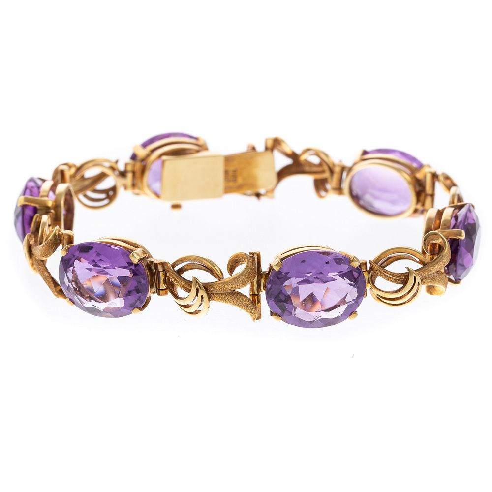 Appraisal: An Amethyst Gold Swirl Link Bracelet in K K yellow