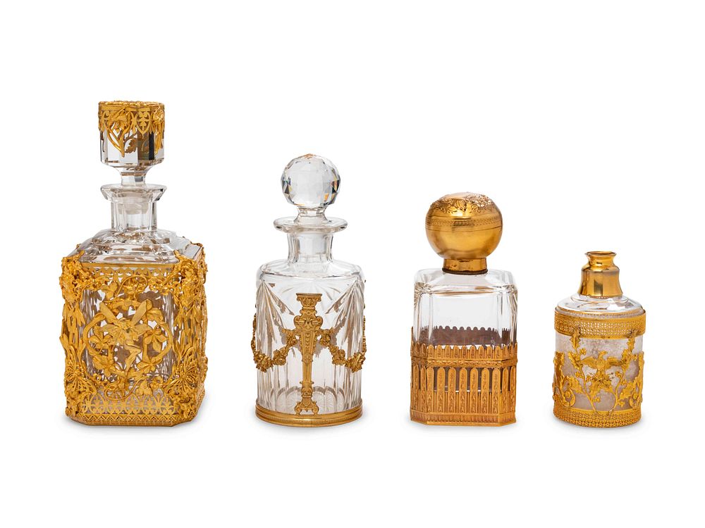 Appraisal: Four French Gilt Bronze Mounted Glass Bottles Four French Gilt