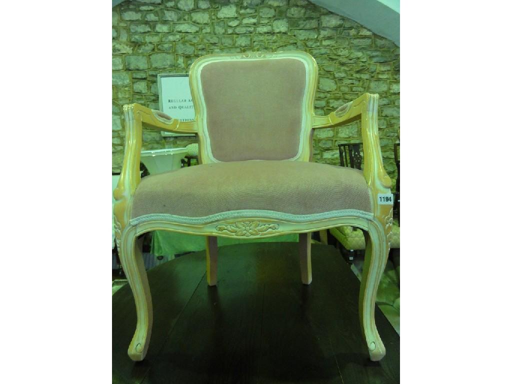 Appraisal: A reproduction fauteuils with serpentine upholstered seat and back within