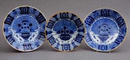 Appraisal: THREE DUTCH DELFT BLUE AND WHITE PEACOCK DEEP DISHES Variously