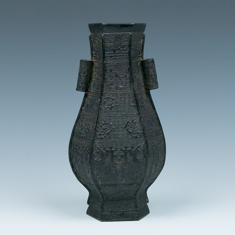 Appraisal: BRONZE ARCHAISTIC STYLE VASE The bronze vase of octagonal section