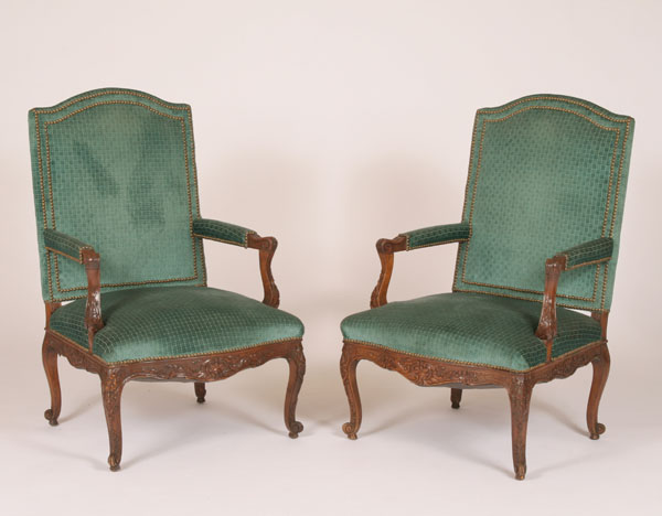 Appraisal: Chippendale style carved upholstered arm chairs hand detailed frame abbreviated