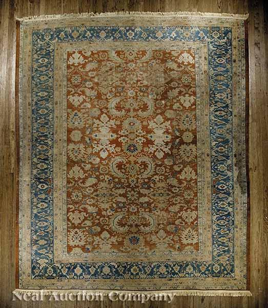 Appraisal: An Antique Persian Carpet salmon and blue ground overall floral