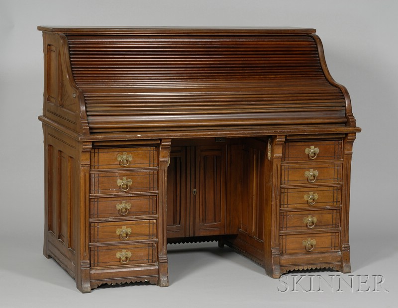 Appraisal: Victorian Eastlake-type Carved Walnut Roll-top Desk with fitted slot interior