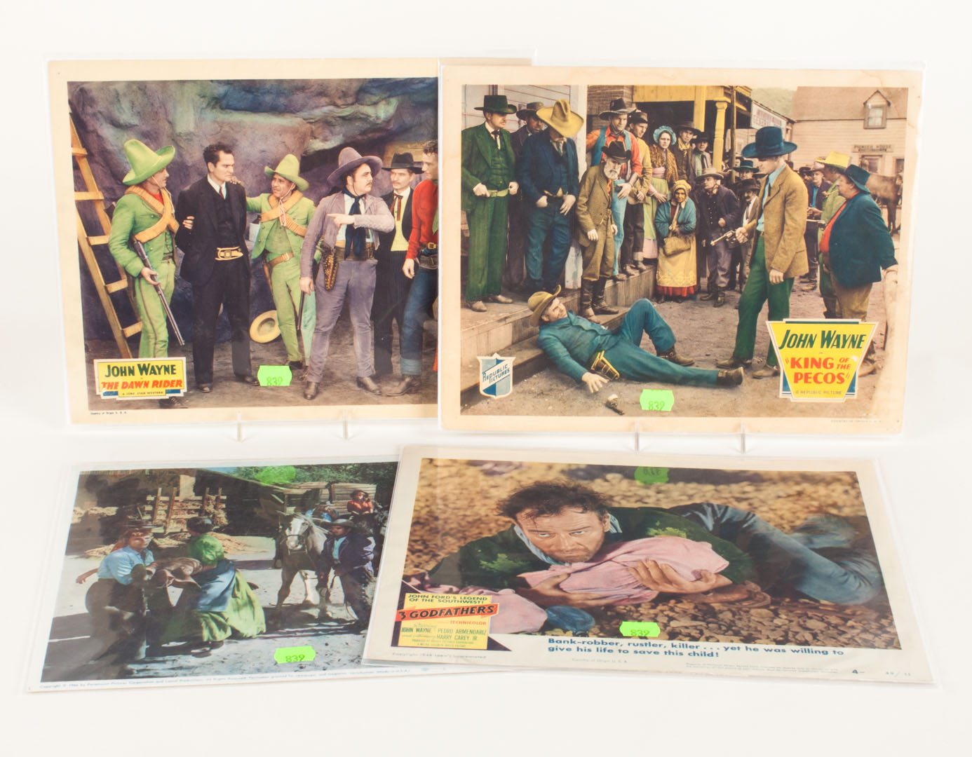 Appraisal: Four John Wayne western movie lobby cards including The Dawn