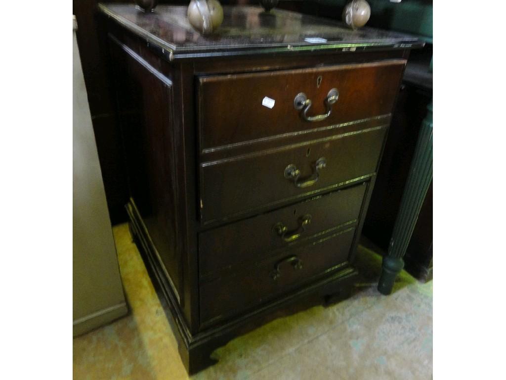 Appraisal: A reproduction mahogany filing cabinet of pedestal form in the