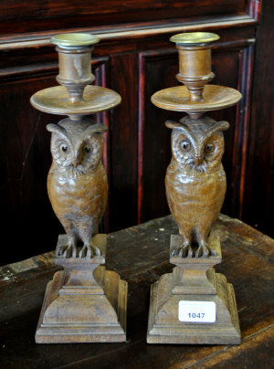 Appraisal: A pair of Victorian oak candlesticks carved as owls on