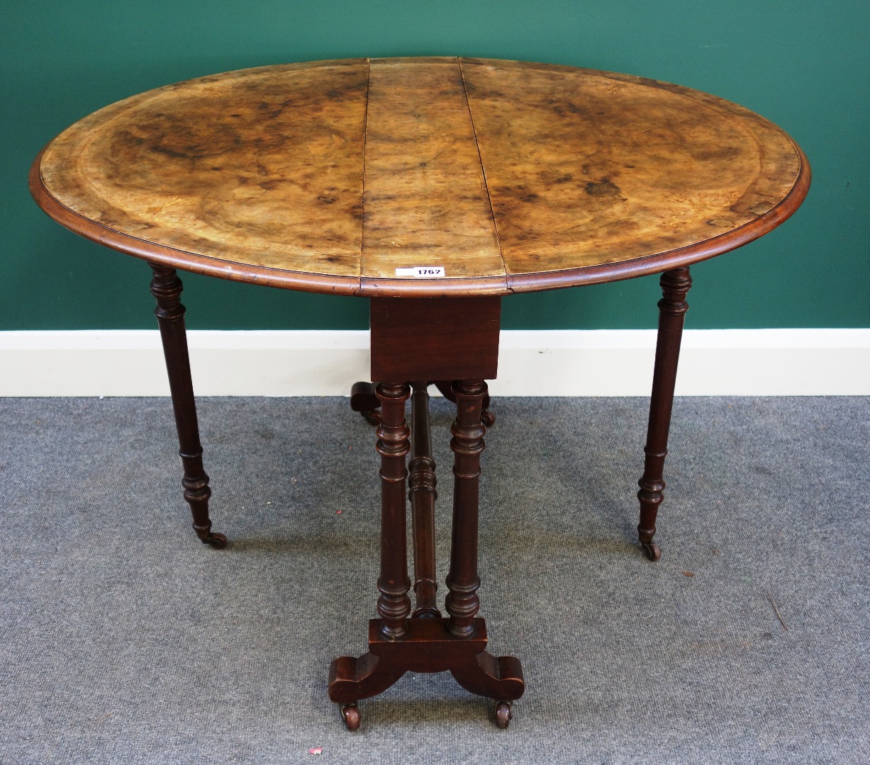 Appraisal: A Victorian marquetry inlaid figured walnut Sutherland table on turned