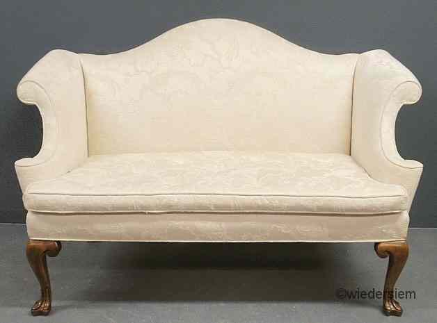 Appraisal: Chippendale style mahogany camelback loveseat ''h x ''w x ''d