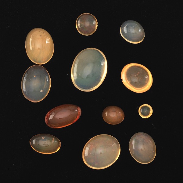 Appraisal: TWELVE UNMOUNTED CT TOTAL MULTI-SHAPE CABOCHON CUT FIRE OPAL GEMSTONES