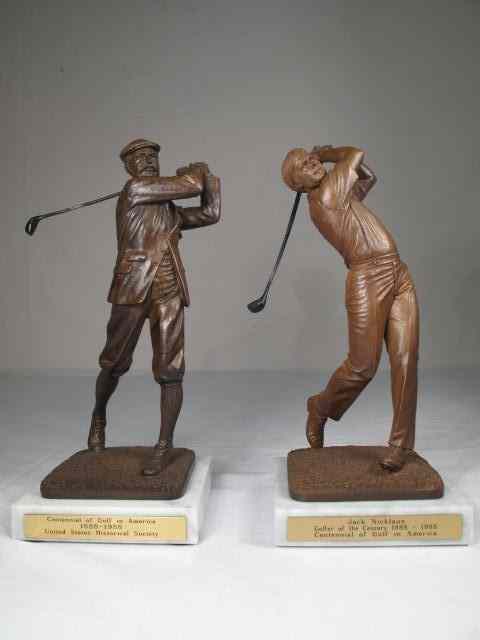 Appraisal: Two composition carved golfer figurines Both on marble bases with