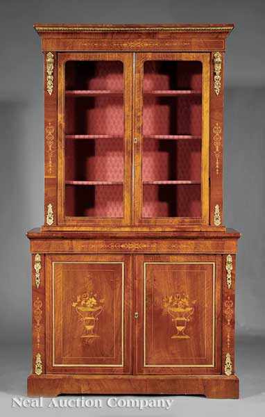 Appraisal: An English Walnut Marquetry and Ormolu-Mounted Bookcase c bronze-mounted cornice