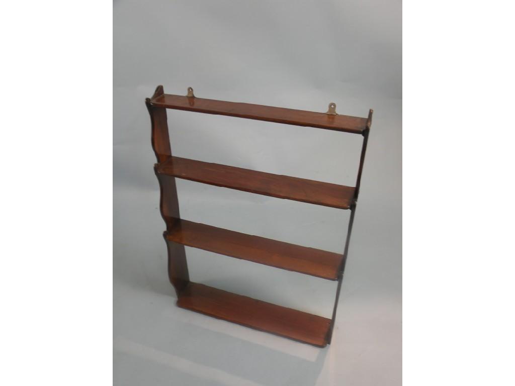 Appraisal: A Victorian wall shelf on shaped end supports cm wide