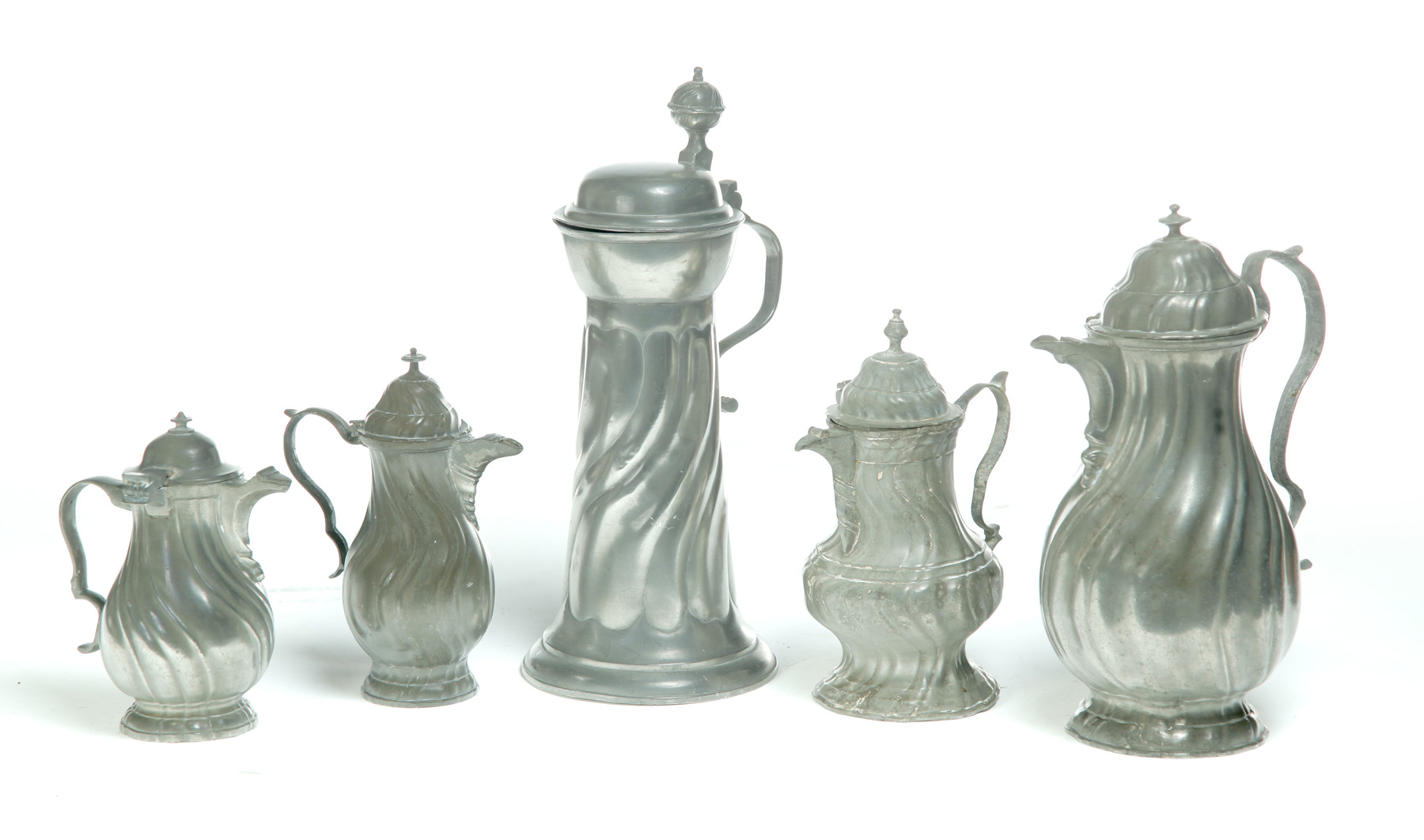 Appraisal: FIVE EUROPEAN PEWTER VESSELS Nineteenth century Tankard h four pitchers