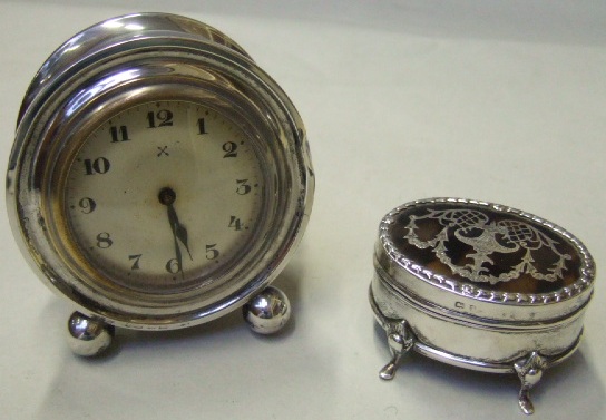 Appraisal: A silver and tortoiseshell hinge lidded oval trinket box decorated