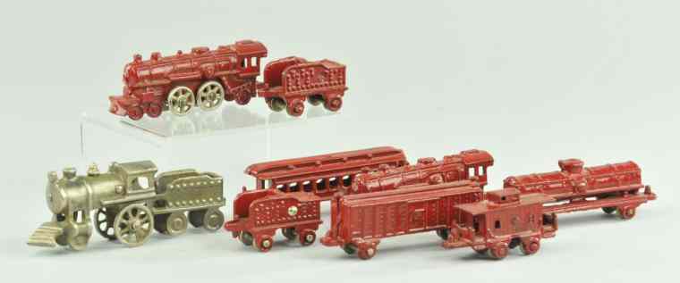 Appraisal: GROUPING OF MINIATURE TRAINS Cast iron includes three locomotives and