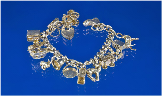 Appraisal: Silver Charm Bracelet Loaded With Silver Charms Comprising Carriage Caravan