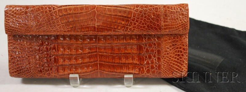 Appraisal: Nancy Gonzalez Crocodile Clutch with magnetic closure in original duster