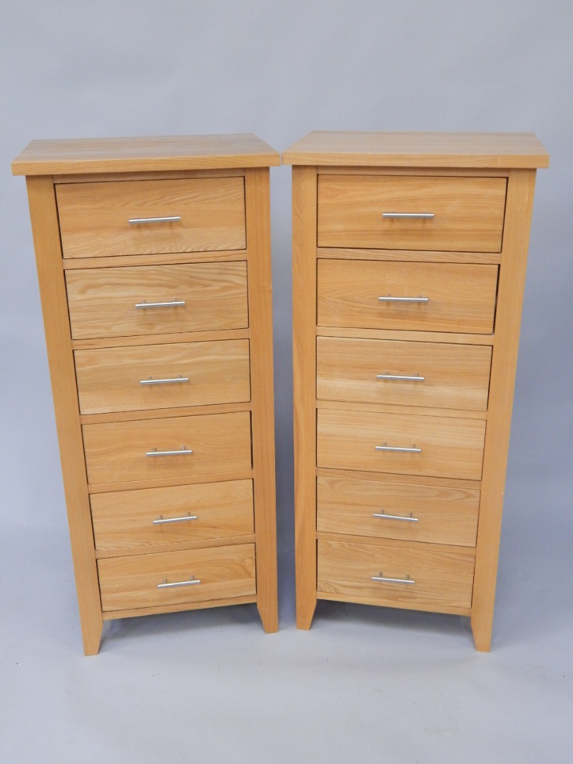 Appraisal: A pair of modern light oak narrow chests of drawers