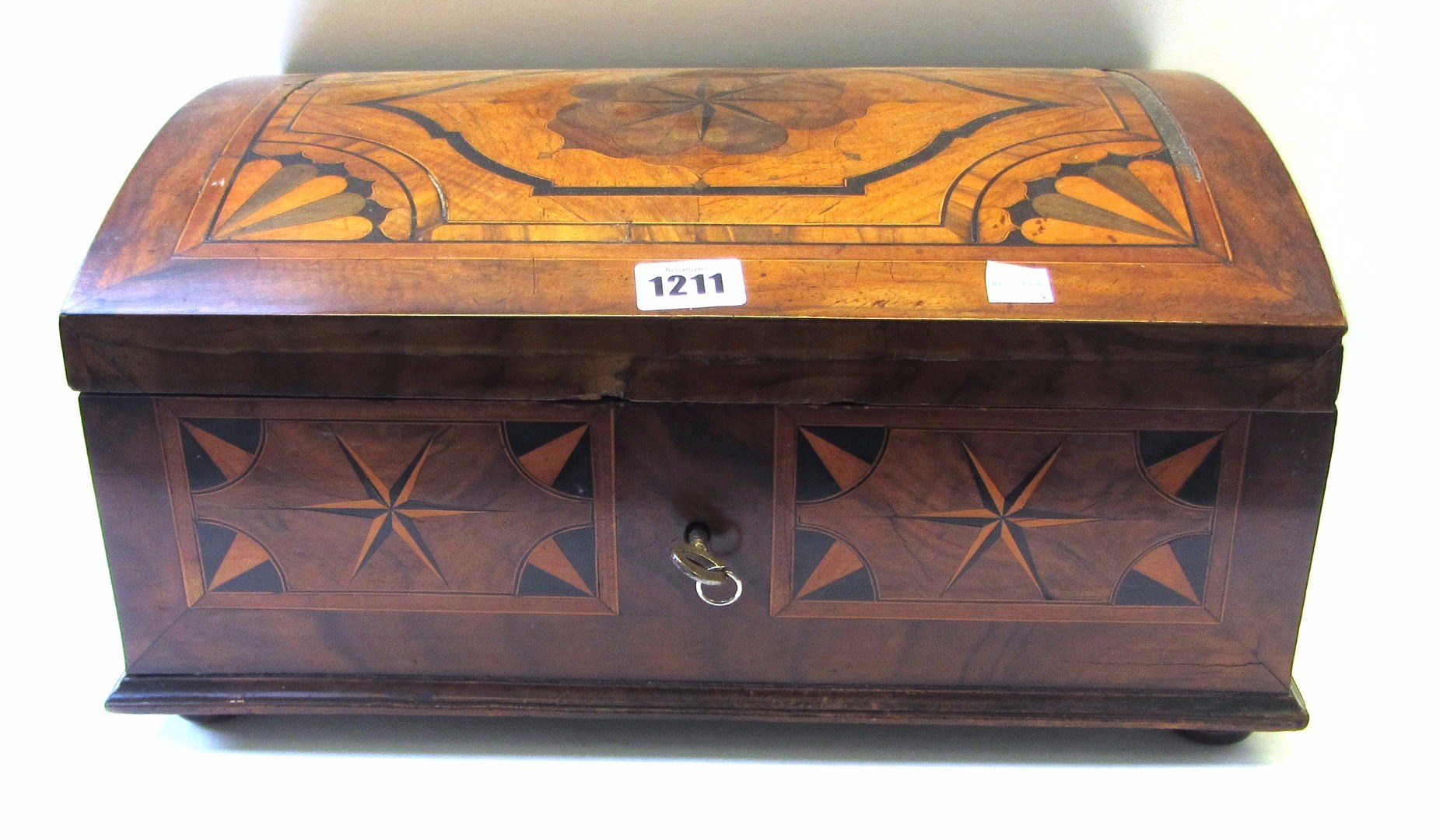 Appraisal: An th century North European marquetry inlaid figured walnut dome