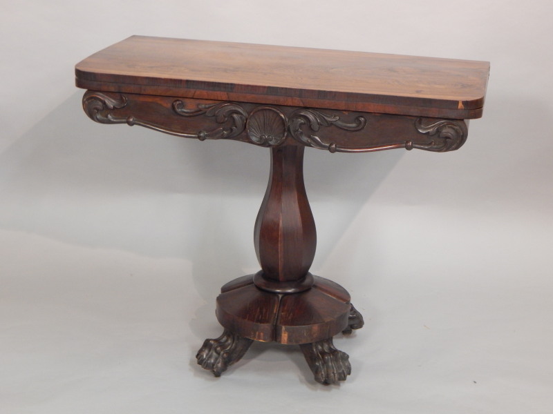 Appraisal: An early Victorian rosewood tea table the rectangular top with