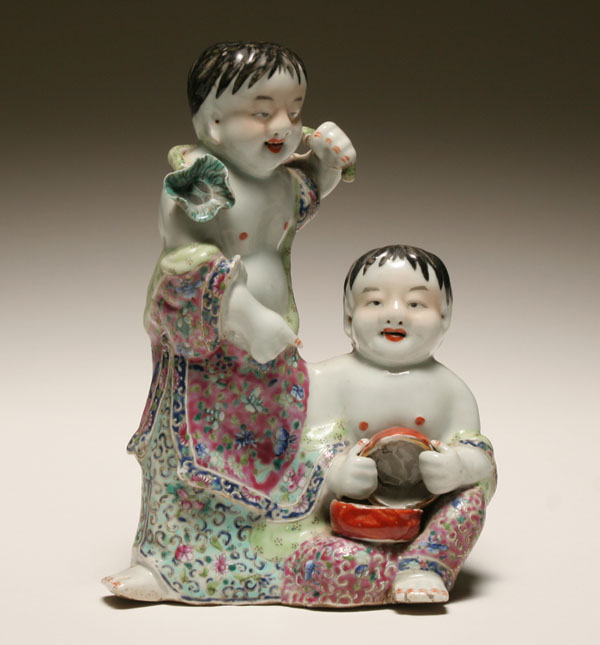 Appraisal: Bathing Asian children ceramic figure two brightly wrapped vintage youngsters