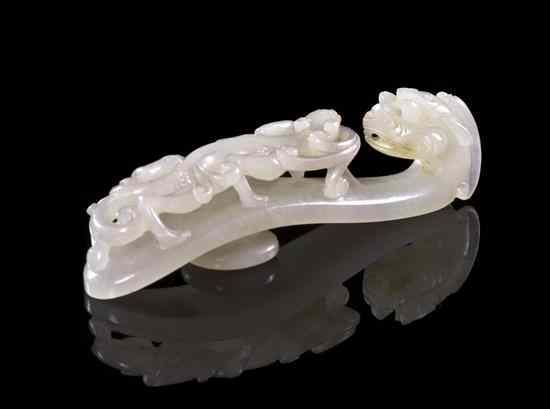 Appraisal: A White Jade Belt Hook of evenly colored white stone