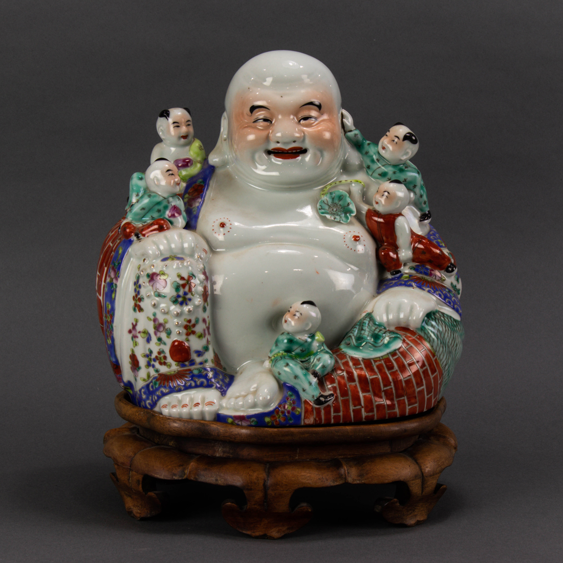 Appraisal: CHINESE FAMILLE VASE FIGURE OF BUDAI Chinese famille vase figure