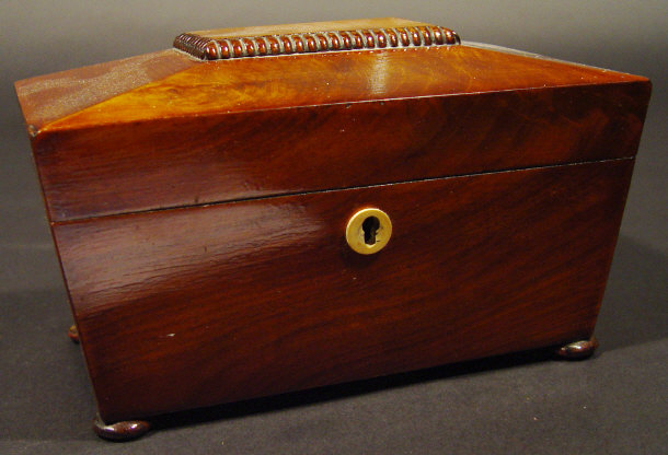 Appraisal: th Century mahogany sarcophagus shaped tea caddy with hinged lid