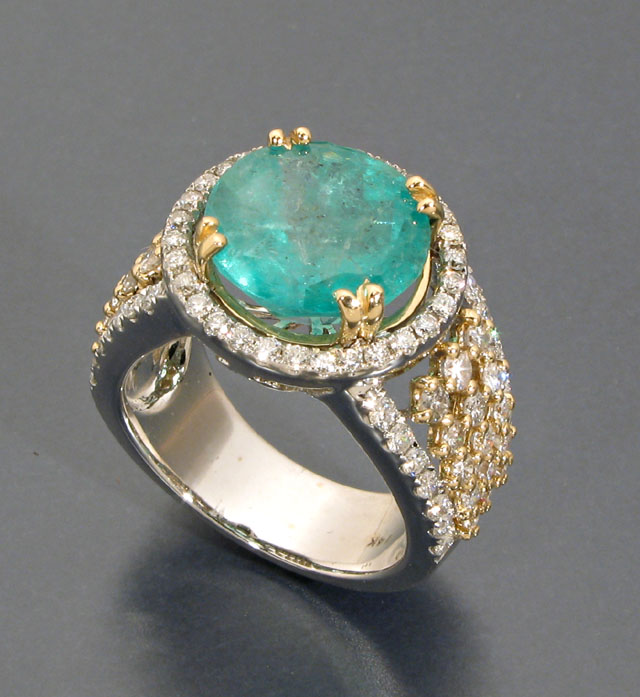 Appraisal: EMERALD DIAMOND AND FOURTEEN KARAT GOLD RING centering a single