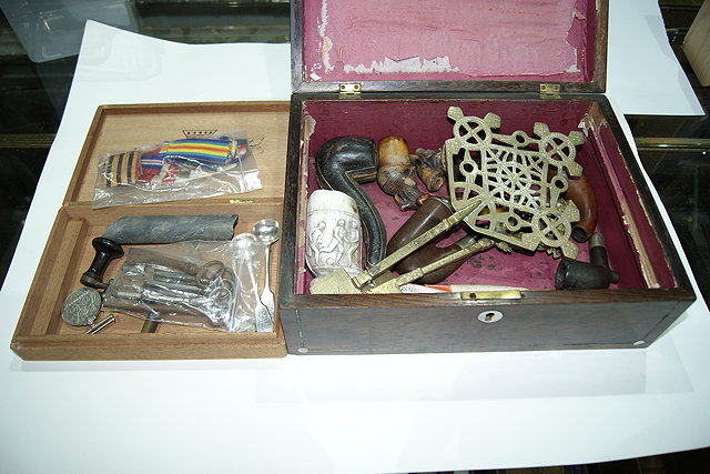 Appraisal: A ROSEWOOD BOX containing various pipes medal ribbons keys and