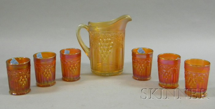 Appraisal: Marigold Carnival Glass Gothic Arch and Grape Pitcher and Six