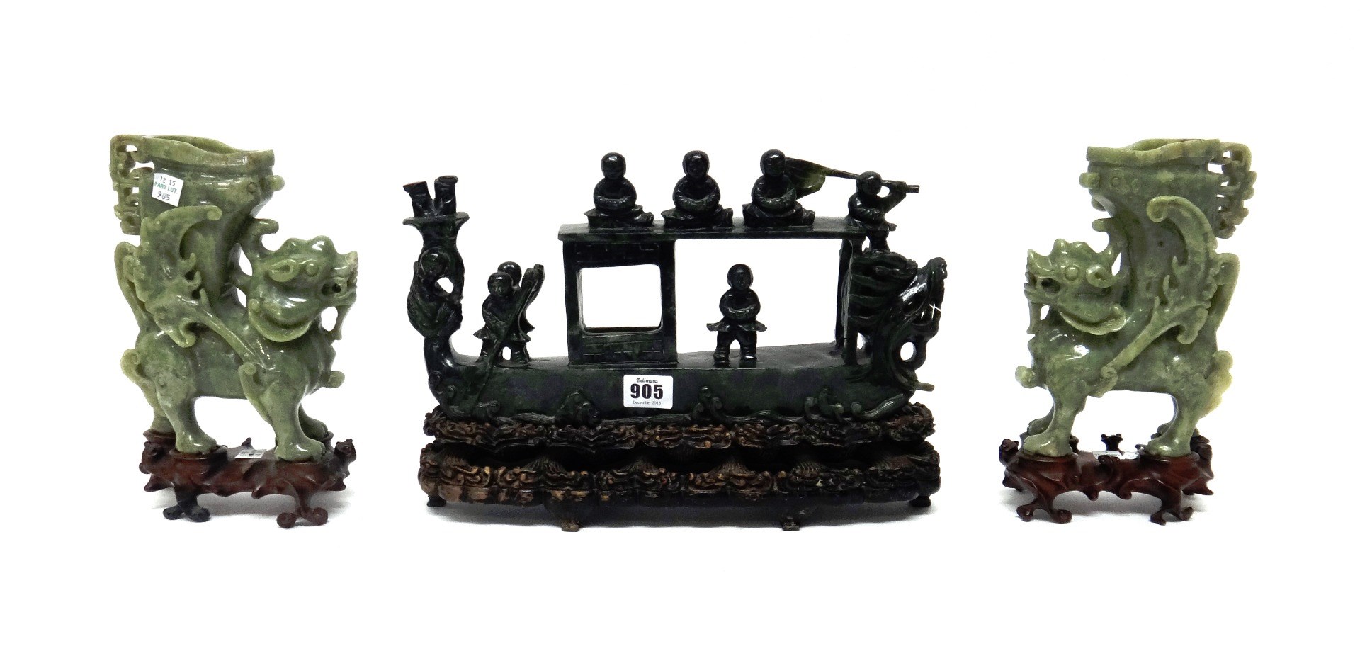 Appraisal: A large Chinese spinach jade group th century carved as